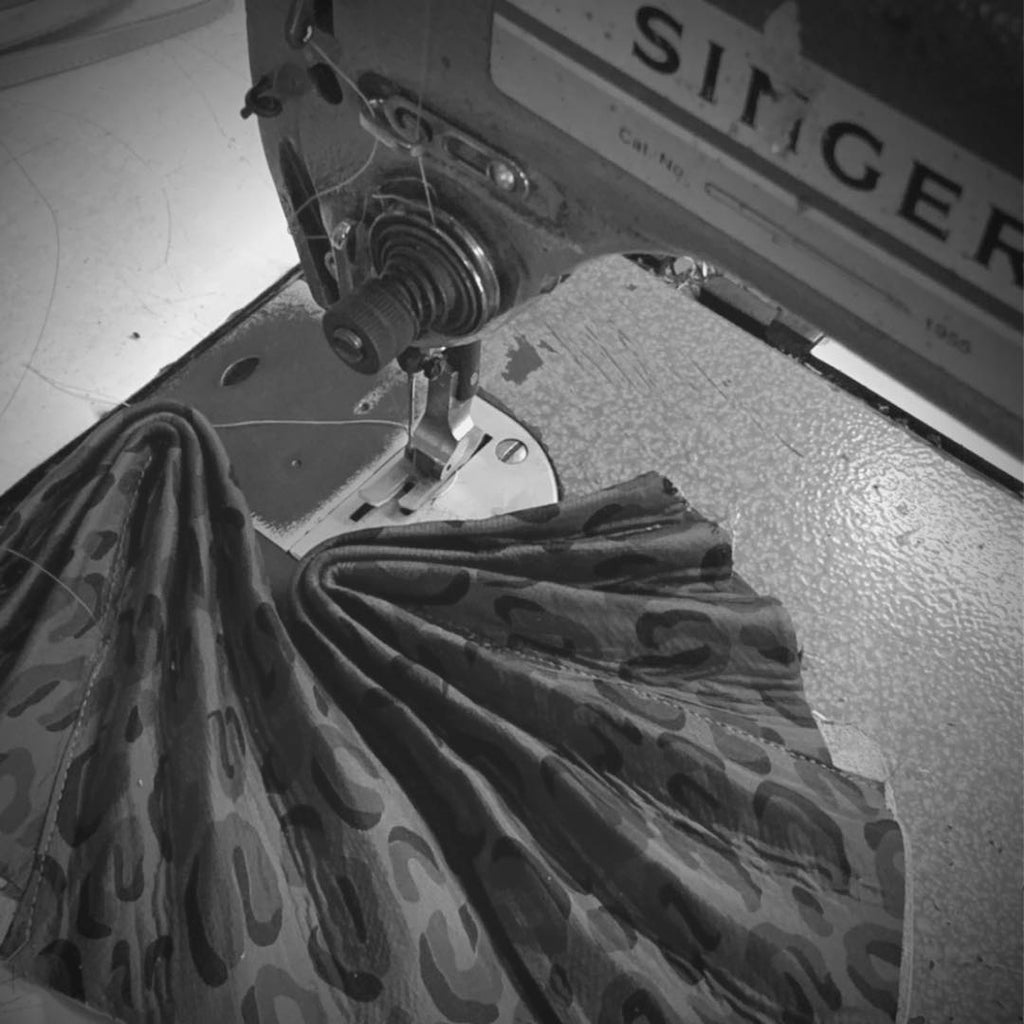 Sucette artisanal shoes process: close-up of upper composent in Thai silk being sewn