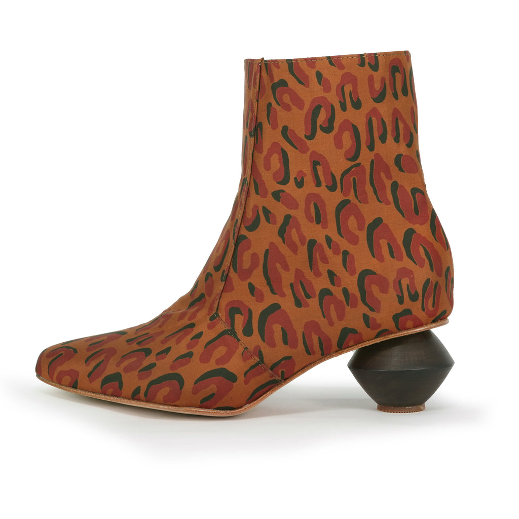 brown leopard ankle boots with carved wooden heel by sucette