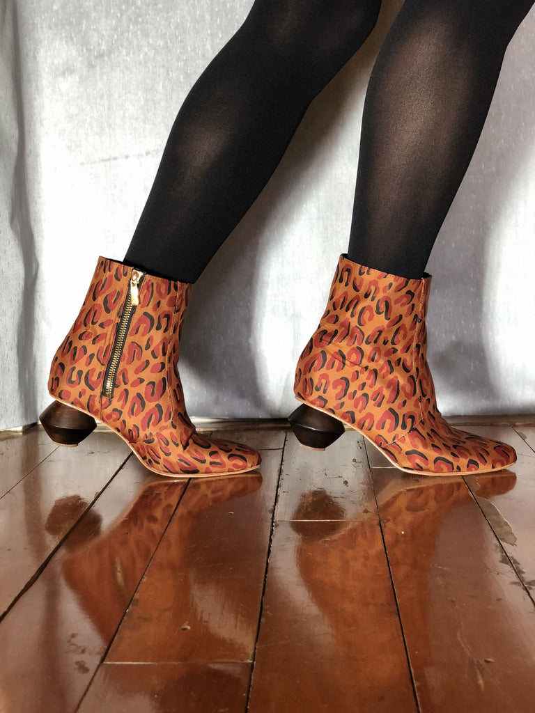 Leopard silk ankle boots with black tights